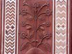 Floral designs carved in the red stone of the Taj Mahal Mosque