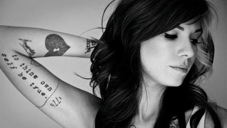 Christina Perri shows of her heart-shaped tattoo