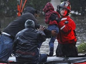 residents including a young child are rescued by emergency personnel from flood waters brought on by hurricane sandy in little ferry N2 Hurricane Sandy: How to Help