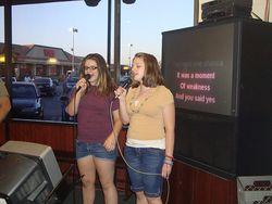 Girls sing karaoke