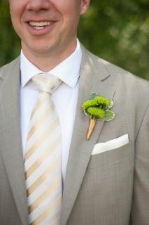 green boutonniere on groom 