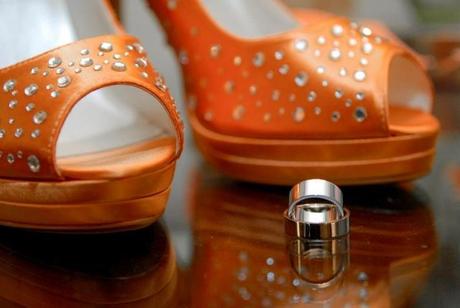 wedding shoes in orange with wedding bands