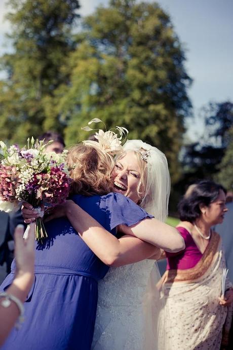 hugging the bride