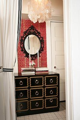 red and white wallpaper, black Dorothy Draper chest and white drapes