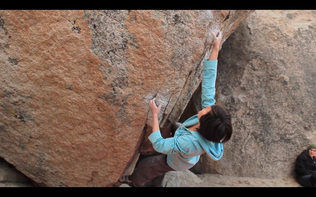 Grabbing the gritty pinch on Fly Boy Arete (V5)