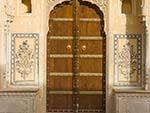 Colourfully decorated wooden door of the Nahargarh For palace