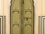 Beautiful decorated green wooden door
