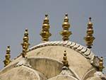 Decorative golden features on the roof of the Hawa Mahal