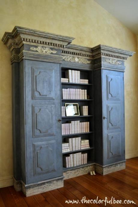 rustic plaster wall and an antiqued bookcase from Tata Shaw