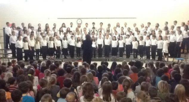 This picture was recently taken of an assembly at Sandy Hook elementary, with hero music teacher Maryrose Kristopik conducting the choir 