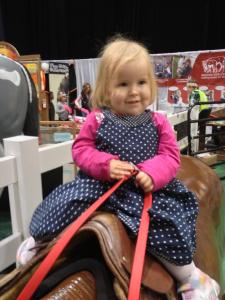 Little Miss Adorable in the saddle.