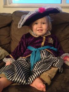 Little Miss Adorable strikes a pose in a glamourous pirate costume.