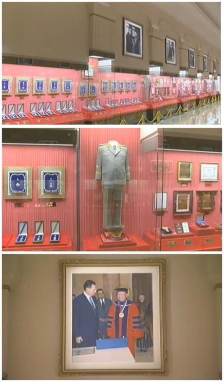 Degrees and titles can be seen in the top image.  In the middle image KJI's military dress uniform and other awards can be seen.  In the bottom image, KJI participates in a hooding ceremony to receive an honorary academic degree (Photos: KCTV/KCNA screengrabs)