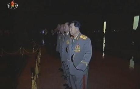 Hyon Chol Hae pays his respects to KJI's remains, along with senior security officials.  Also visible in this image is Gen. Kim Won Hong (Photo: KCTV/KCNA screengrab)