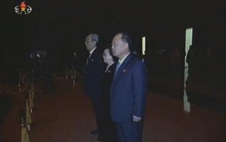 Kim Ki Nam (1st from the top), Kim Kyong Hui (2nd from the top) and Choe Chun Sik (3rd from the top) pay their respects to KJI's remains (Photo: KCTV/KCNA screengrab)