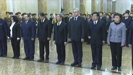 Foreign diplomats stationed in the DPRK.  Among those in this image are Alexandr Timonin, 3rd R, Russian Federation Ambassador to the DPRK and Liu Hongcai, 2nd R, PRC Ambassador to the DPRK (Photo: KCTV/KCNA screengrab) 