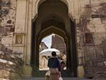 Sonya walking through the main multi gates of Dodh Kangra Pol entrance to Mehrangarh Fort