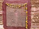 Hindu script with a Marigold wreath found at the Mehrangarh Fort wall