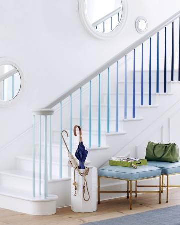 blue ombre effect on the spindles of a staircase from Martha Stewart