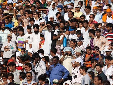 The mens section of the grandstands waiting for the show