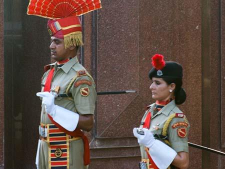 Two Indian guards waiting for the lowering of the flags