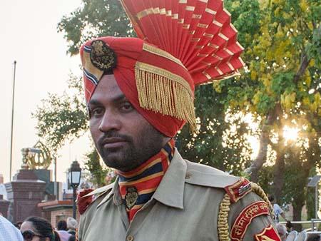 Indian guard wearing official uniform and headwear