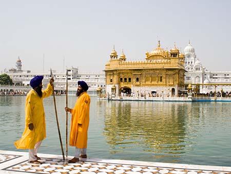 Two Sikh men wearing royal blue turbans common among Sikh ministers and gyanis