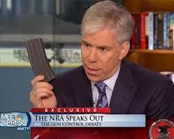 David Gregory holding empty magazine