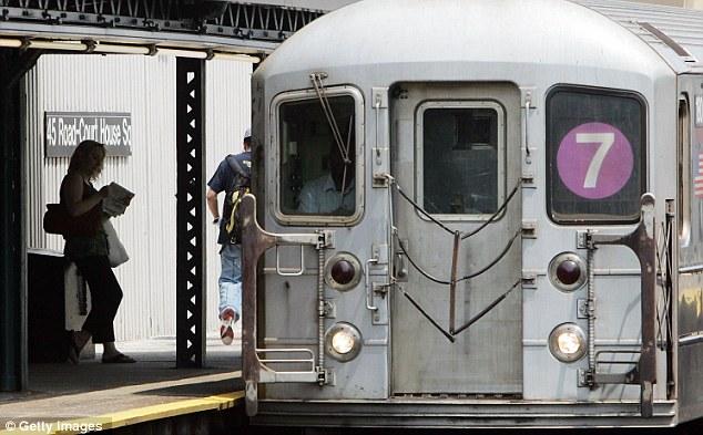 Shocking: The man, who hasn't been identified, was standing on the elevated platform of a 7 train in Queens at about 8pm when he was shoved on the tracks