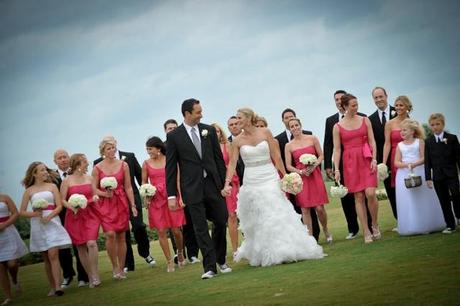 Bridal party with brides in pink dresses short pink bridesmaids dresses and bridal party