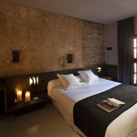 Caro Hotel in Valencia Spain. Rustic walls and new furnishings