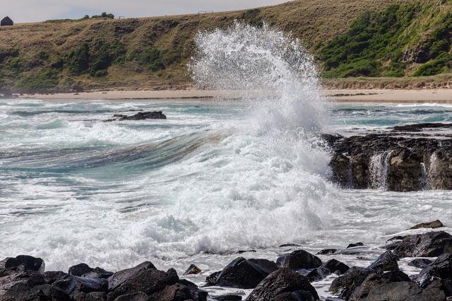 wave breaking on rocks