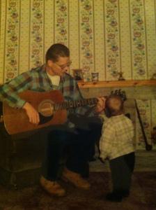 My Pops, playing guitar, unsure whether the child is me or not!? 