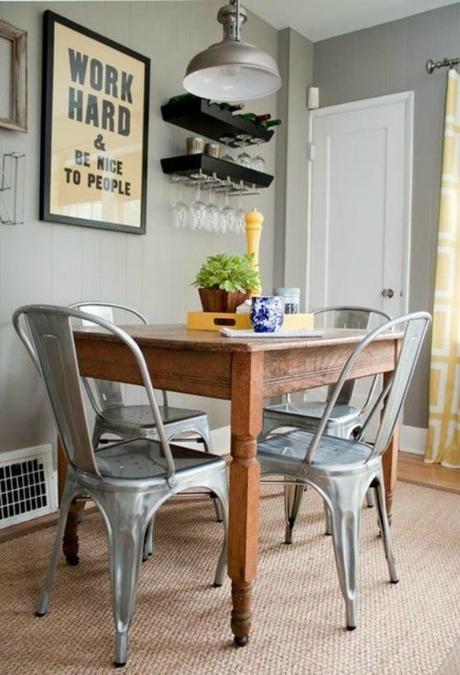 side of mustard NookAndSea-Light-Grey-Gray-Walls-Paint-Modern-Metal-Chairs-Dining-Room-Area-Nook-Wine-Glass-Rack-Holder-Art-Quote-Wood-Table-Curtains-Panels-Mustard-Yellow-Centerpiece-Display