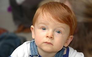 Redheaded child mesmerized.