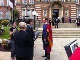Alex Accepts His Doctorate