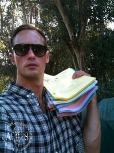 Alexander Skarsgard holding the script that is up for auction