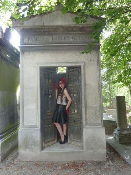 Black Widow 
This look just came together from a random search of my closet and accessories. I have a lot of red in my wardrobe and as per usual just hoped for the best when shooting. We went for a Black widow look, at the crypt (I actually changed my clothes inside this tomb - scary stuff!) In mourning but rockin it is the feeling i had going on.
The miniture tilt hat and netting was inspired by Dita Von Teese’s sexy photos taken at the same cemetery - the rest is just me, wrapped in a bow.
xoxo LLM