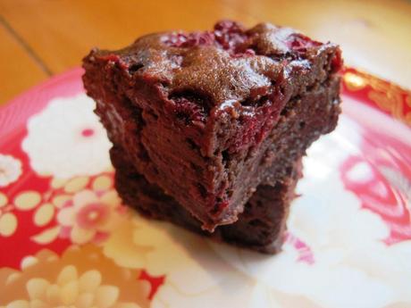 Two slices of raspberry brownie on a plate