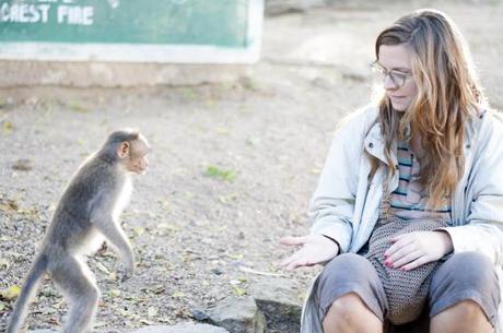 Courtney has to show the monkey she has no more food. 