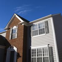 Exterior of brick and vinyl siding house and our new efficient windows 