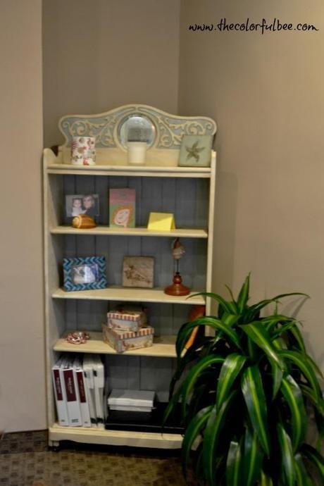 a revamped antique bookcase with off white and pale blue paint and antiqued
