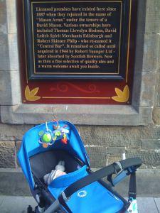 Little Mr A underneath the plaque on the pub his great, great grandad owned in St Andrews