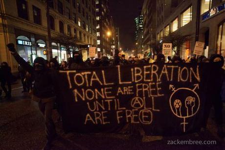 Total Liberation banner, Jan 14, 2013, protest against Enbridge hearings in Vancouver.