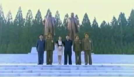 Commemorative photo taken in front of the KIS-KJI statues at the Ministry of the People's Armed Forces.  In this image (L-R): Hwang Pyong So, VMar Kim Jong Gak, Ri Sol Ju, Kim Jong Un, Gen. Choe Ryong Hae and Gen. Hyon Yong Chol (Photo: KCTV screengrab)