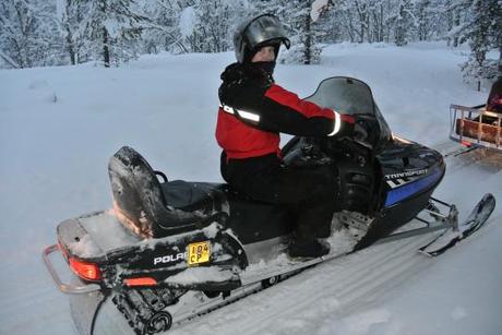 Me driving the Snowmobile through the Forest in Lapland near Saariselska