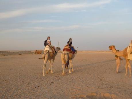 My sons riding away on their camels