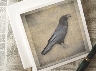 Raven card, a solitary raven with each feather in exquisite detail is printed on a background texture with the look of old linen.