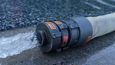 Firefighters Battle A Warehouse Blaze - Water Turns To Ice