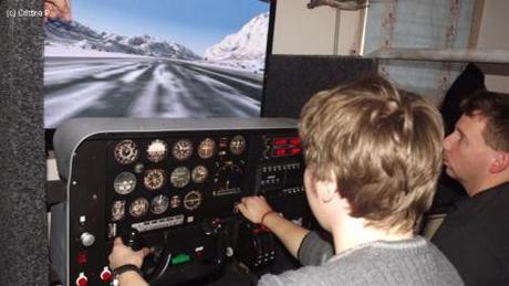 Alex flying a plane in virtual reality